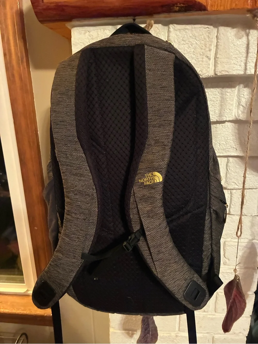 The North Face Black Heather Backpack with Yellow Logo